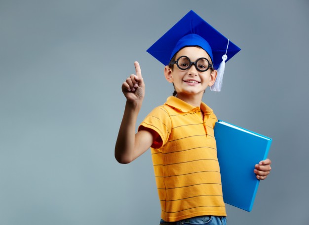 proud-little-boy-with-glasses-graduation-cap_1098-3424